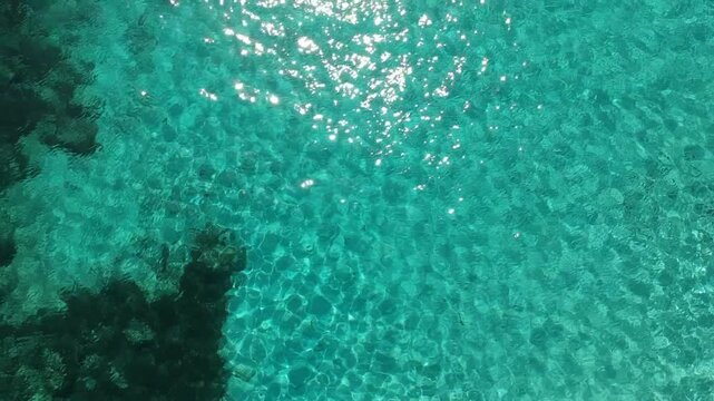 Sunbathers on Sandy Beach Seen from Above Nadir Aerial Drone Shot Cala Mitjana Menorca Spain Balearic Islands