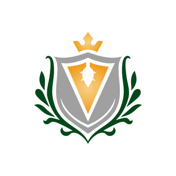 Golden Heraldic Shield with Wings Crown Laurel Wreath and Ribbon Coat of Arms Vector Illustration for Royal Crest Emblem Vintage Badge Logo Design