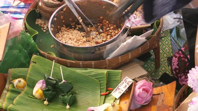 Making Miang Kham (traditional Southeast Asian herbal snack from Thailand and Laos), Traditional Thai snack. It&rsquo;s a snack containing different ingredients of herbs and vegetables.