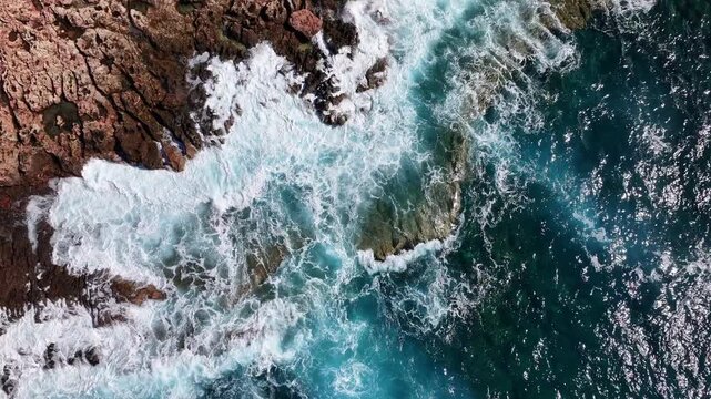 Aerial view of a storm wave on a rocky coast