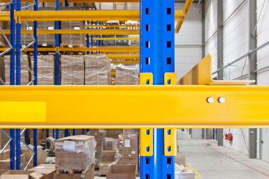 Warehouse with steel shelves and packaged boxes, in a goods warehouse to be shipped.