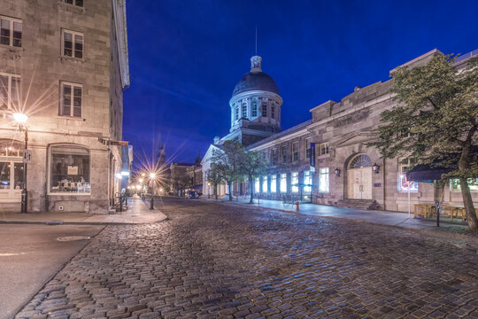 Dawn, old Montreal city centre, historic buildings and city square.