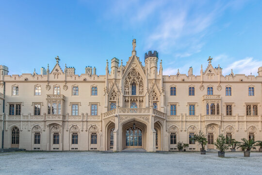Lednice Castle, the facade of an 18th century gothic castle, elaborate entrance and carved stonework.