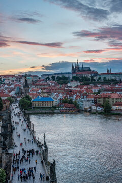 Charles Bridge and Prague Castle at Sunset, elevated view of the river Vtlava and historic buildings