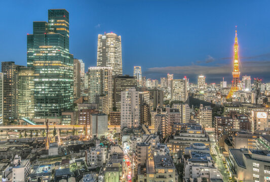 Japan, Tokyo, Roppongi, elevated view over the city district, densely packed buildings, tall and low, the city at night.