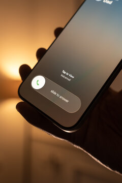 Person Receiving and Answering an Incoming Call on a Smartphone.