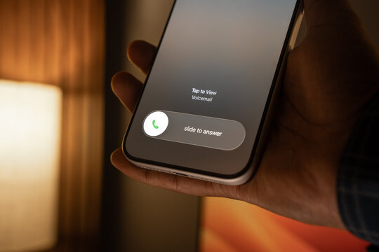 Person Receiving and Answering an Incoming Call on a Smartphone.