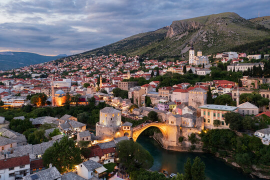 The Old Town and the Mostar Bridge, the 16th-century Ottoman bridge at dusk.