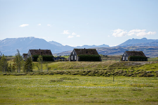 Traditional Icelandic Turf Houses in Scenic Mountain Landscape