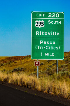 Road sign for Ritzville and Tri-Cities exit off Interstate 90, Exit 220, road reference 395.