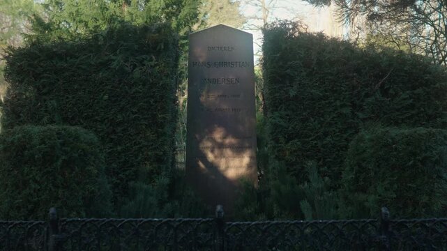 The grave of Hans Christian Andersen, the world-renowned Danish writer and poet from the 19th century. Gimbal shot