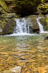  Maiden's Tears (Divochi Slyozy) Waterfall  cascades through the lush Carpathian forest creating a tranquil natural landmark with crystal clear mountain water in Yaremche, Ukraine © Olga Biliak