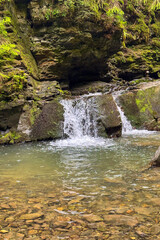  Maiden's Tears (Divochi Slyozy) Waterfall  cascades through the lush Carpathian forest creating a tranquil natural landmark with crystal clear mountain water in Yaremche, Ukraine © Olga Biliak