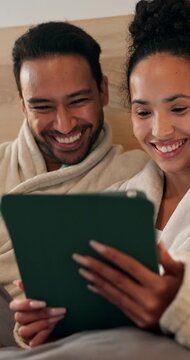 Tablet, laugh and couple on bed in house with funny meme on social media, internet or website. Relax, digital technology and man with woman in bedroom for reading comic blog on app in apartment.