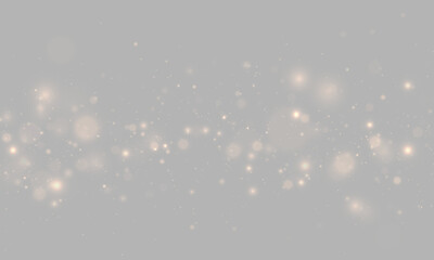 Fototapeta premium Sparkling gold powder creates a soft luminous cloud. Floating bokeh particles and glittering stars add magical warmth to elegant holiday designs. PNG.