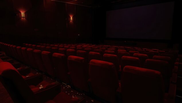 Vacant red seats in a dimly lit cinema row, film and debut theme.