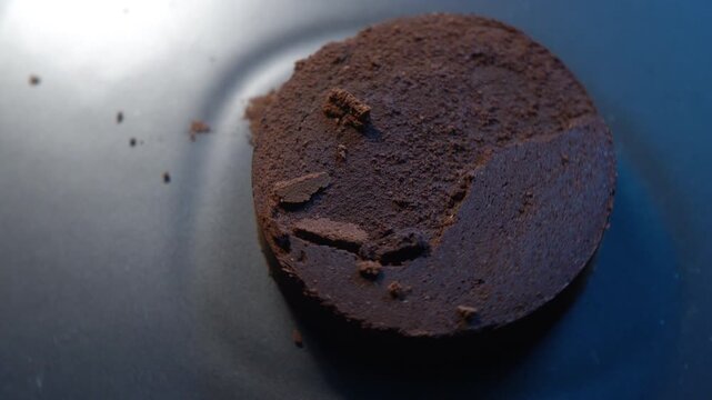 A coffee puck is the tightly compacted disk of used coffee grounds left behind in the espresso machine's portafilter after an espresso shot has been pulled.