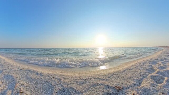 Waves on the shoreline at golden hour, Mari Ermi beach, Sinis Peninsula, Sardinia, Italy