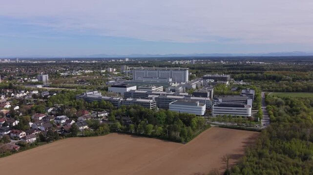 Panoramic view of LMU University Hospital Grosshadern in Munich suburbs. Major public healthcare institution with modern hospital buildings, medical campus and research infrastructure.
