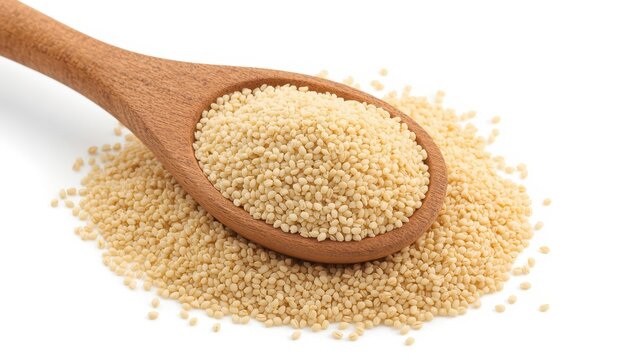 Wooden spoon with raw organic semolina on white background, side angle.