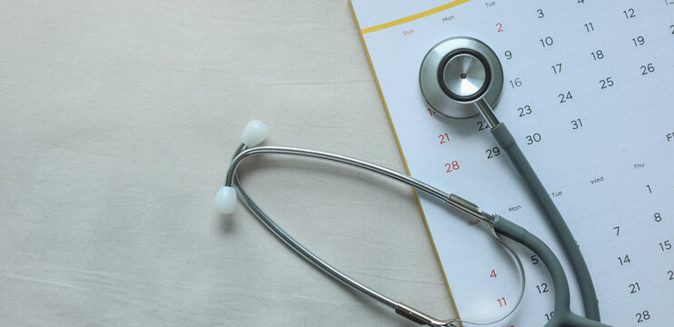 top view on stethoscope on calendar 2026 with over blue background for design about ads or banner of doctor appointment and health checkup following personal lifestyle concept