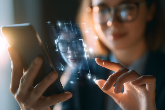 Businesswoman using facial recognition biometric login on smartphone, digital identity verification