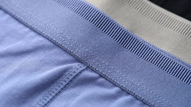 Blue, beige and black mens jersey underwear garments with elastic waistbands.
