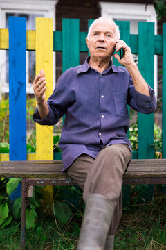 Senior man talking on phone outdoors