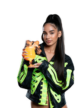 Beautiful Woman in Neon Green Skeleton Jacket Holding Smoking Halloween Cocktail isolated on transparent or white background, png