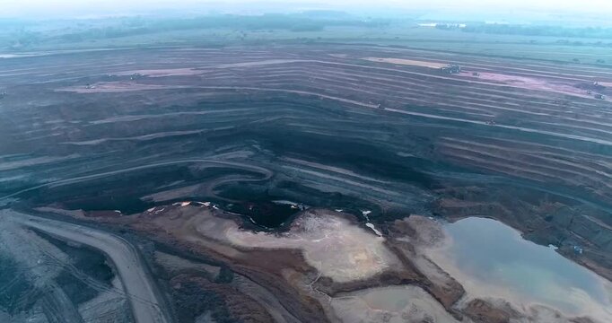 Aerial Drone View of Terraced Open Pit Coal Mine with Heavy Machinery in India