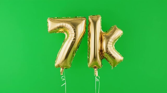 Gold Number 7k Balloons floating against a vibrant green background celebratory concept
