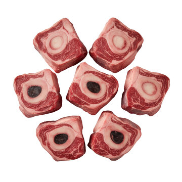 close-up macro of raw osso buco beef shanks, showing ruby-red meat, thick white marbling, and glistening bone marrow on a transparent studio backdrop. Commercial product aesthetic
