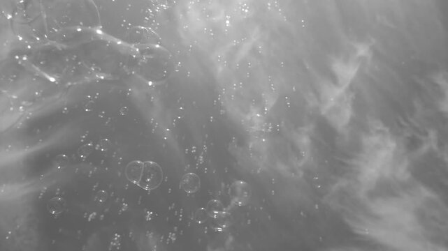 Monochrome Soap Bubbles Flying Close and Drifting High in an Abstract Sky