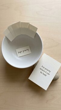 Organizing tasks for Low Attention Span individuals, showcasing prioritization with notes in a bowl