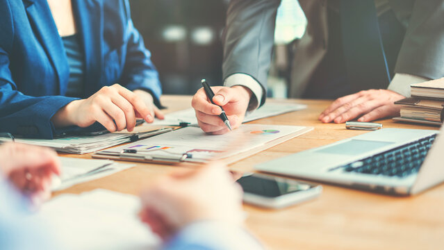Corporate team analyzing project plan and budget