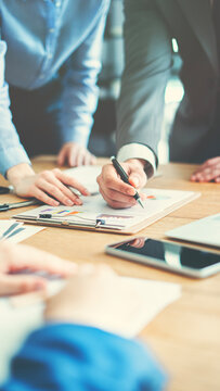Corporate team analyzing project plan and budget