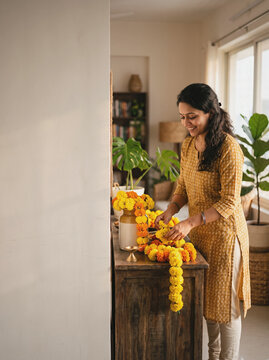 Decorating Indian Home Living Room with Marigolds and Diyas