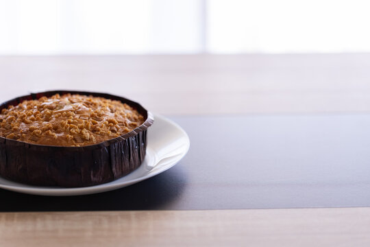 Fresh Baked Caramel Dessert on a Dinner Table. Closeup, selective focus.