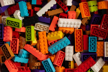 Fototapeta premium Colorful mix of plastic Lego building blocks and bricks background