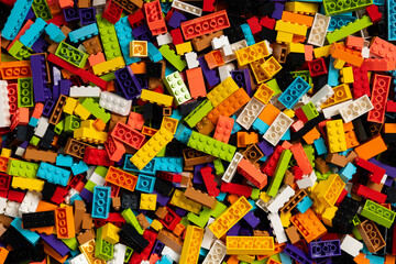 Fototapeta premium Colorful mix of plastic Lego building blocks and bricks background