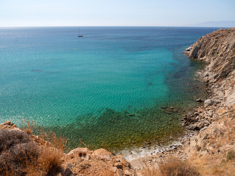 Yachts at sea on Kalo Livadi beach on Mykonos Island in Greece.