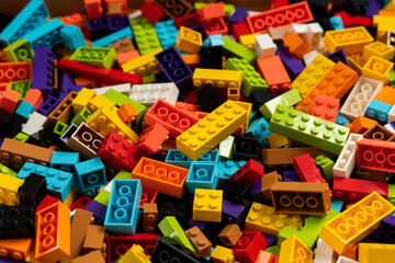 Fototapeta premium Colorful mix of plastic Lego building blocks and bricks background