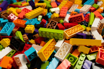 Fototapeta premium Colorful mix of plastic Lego building blocks and bricks background