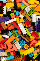 Fototapeta premium Colorful mix of plastic Lego building blocks and bricks background