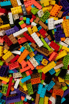 Colorful mix of plastic Lego building blocks and bricks background