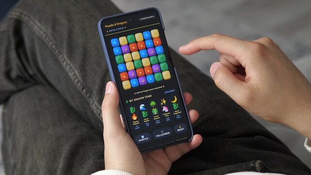 Hand swiping the screen to build an optimized fantasy dragon squad for battle. Highlights the depth of synergy-based team building in modern gacha gaming.
