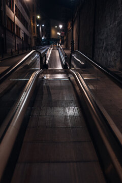 Escalator at Night in a Run-Down Urban Neighborhood