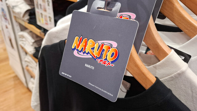 Official Uniqlo UT Naruto Vinto collaboration anime collection tag attached to t shirt on rack in retail store on July 21, 2026 in Bangkok, Thailand
