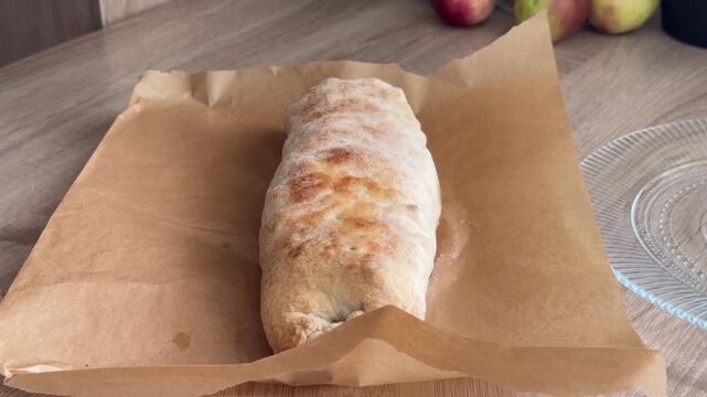 Brushing freshly baked pastry with melted butter using a silicone pastry brush