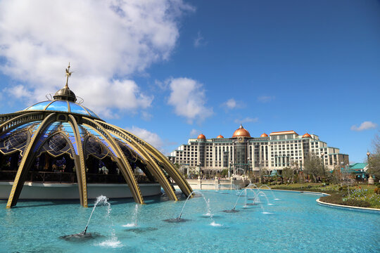 Exterior facade of the Helios Hotel in Orlando and Carousel at Celestial Park